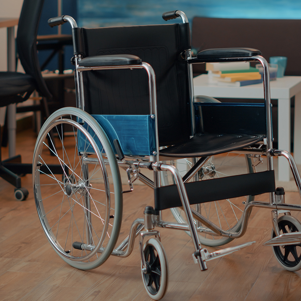 Wheelchair in empty space used by someone with physical disability
